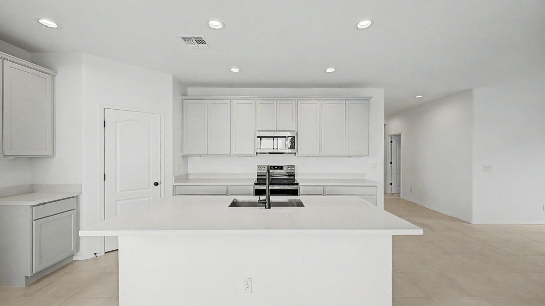 Kitchen island move-in ready single-story Clover by DRB Homes at Sienna Park, 1315 S. 215th Dr., Buckeye, Arizona 85326 Kitchen island move-in ready single-story Clover by DRB Homes at Sienna Park, 1315 S. 215th Dr., Buckeye, Arizona 85326