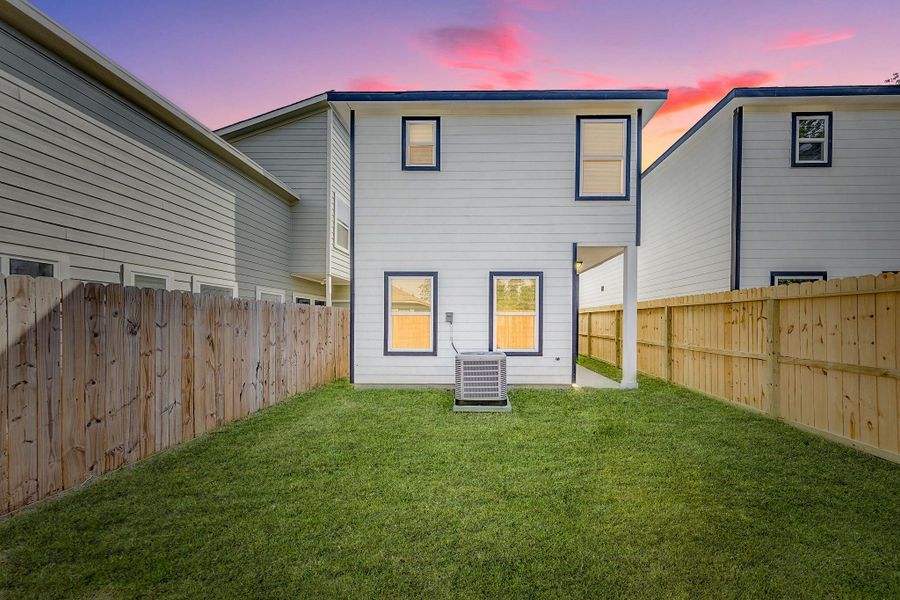 The perimeter is completely fenced, offering a secure and private outdoor retreat perfect for quiet afternoons or weekend family gatherings.