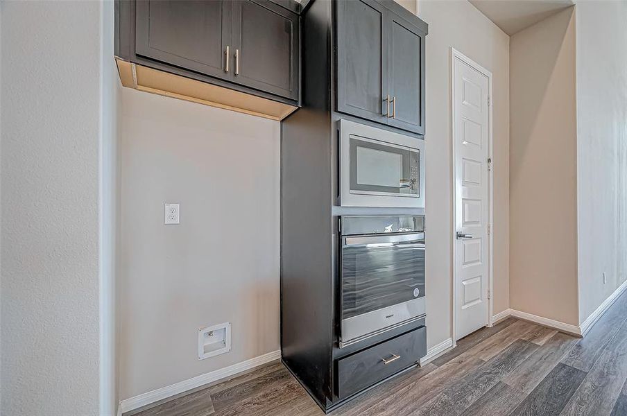 Built-in stainless steel appliances, including a 5-burner gas range.A walk-in pantry and an additional closet for extra storage.