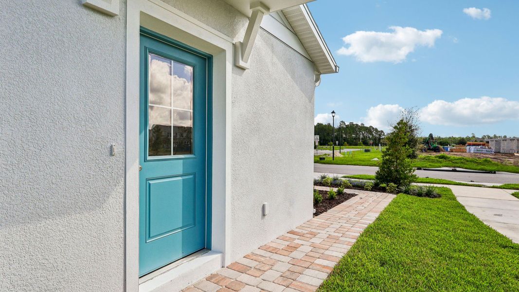 Exterior details and patio area of a home in Cyrene at Harmony, St. Cloud (Image 4).