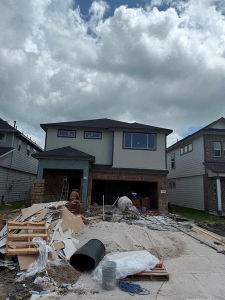 Front exterior of a new home in Anderson Lakes, Houston, TX, highlighting curb appeal (Image 2). Front exterior of a new home in Anderson Lakes, Houston, TX, highlighting curb appeal (Image 2).