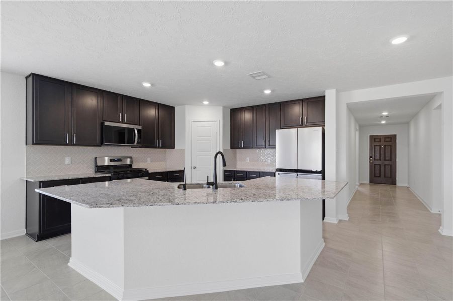 The kitchen truly serves as the heart of this home, offering an abundance of storage options to keep your culinary space organized and clutter-free.