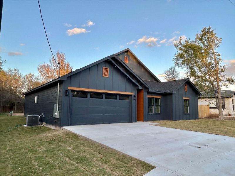 Front exterior of a new home in , Bastrop, TX, highlighting curb appeal (Image 23).
