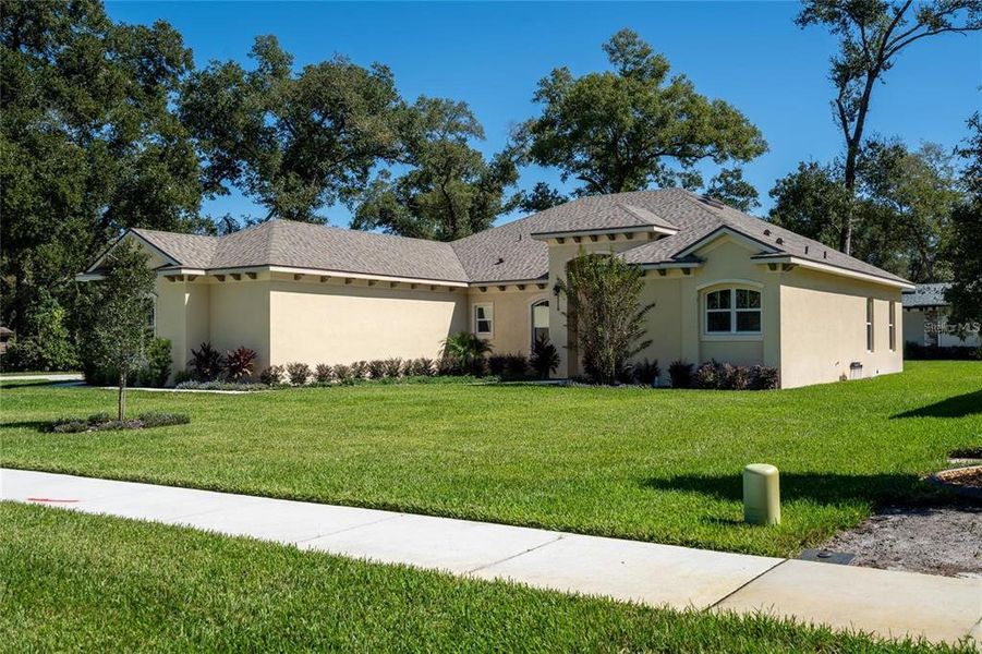 Front exterior of a new home in , Orange City, FL, highlighting curb appeal (Image 16).