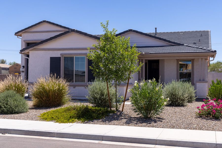 Front exterior of a new home in Rancho Mirage, Maricopa, AZ, highlighting curb appeal (Image 24). Front exterior of a new home in Rancho Mirage, Maricopa, AZ, highlighting curb appeal (Image 24).