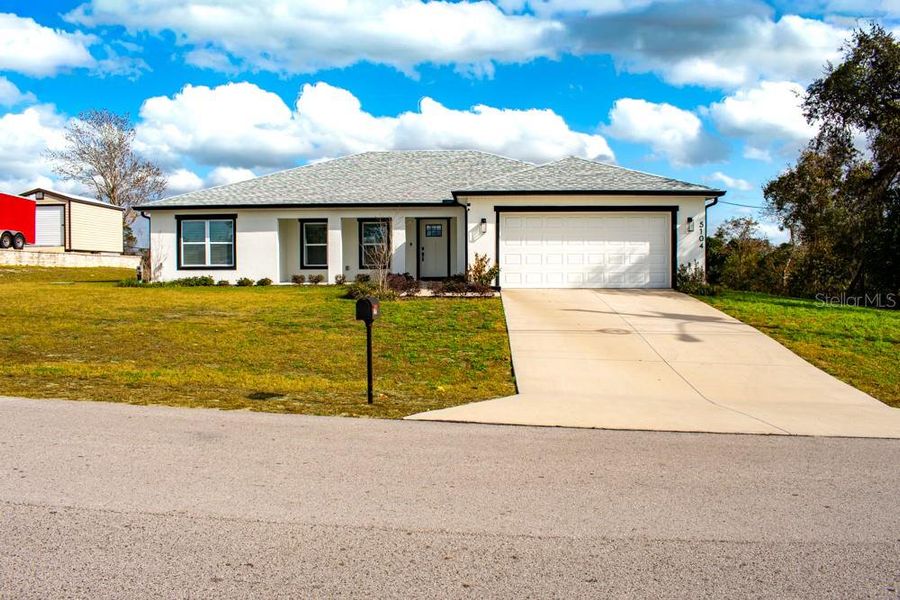 Front exterior of a new home in , Spring Hill, FL, highlighting curb appeal (Image 1). Front exterior of a new home in , Spring Hill, FL, highlighting curb appeal (Image 1).