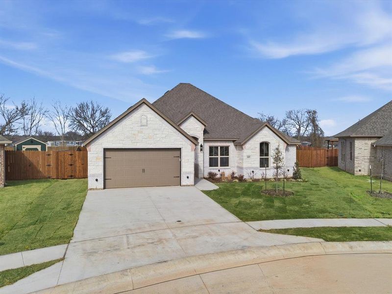Front exterior of a new home in , Springtown, TX, highlighting curb appeal (Image 21). Front exterior of a new home in , Springtown, TX, highlighting curb appeal (Image 21).