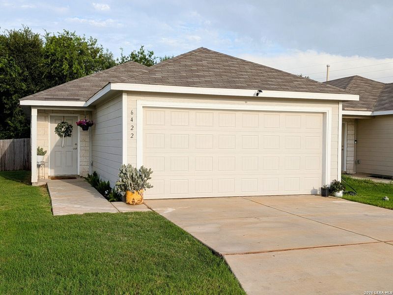 Front exterior of a new home in Thea Meadows: Belmar Collection, San Antonio, TX, highlighting curb appeal (Image 1). Front exterior of a new home in Thea Meadows: Belmar Collection, San Antonio, TX, highlighting curb appeal (Image 1).