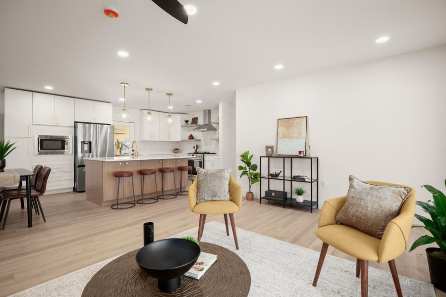 Sitting room featuring light wood finished floors, recessed lighting, and a ceiling fan
