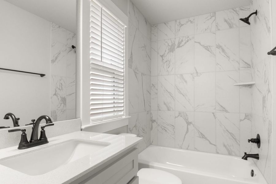 Representative furnished interior of a home built from the Clear Creek 1782 by Brohn Homes in Clear Creek, Round Rock (Image 8).