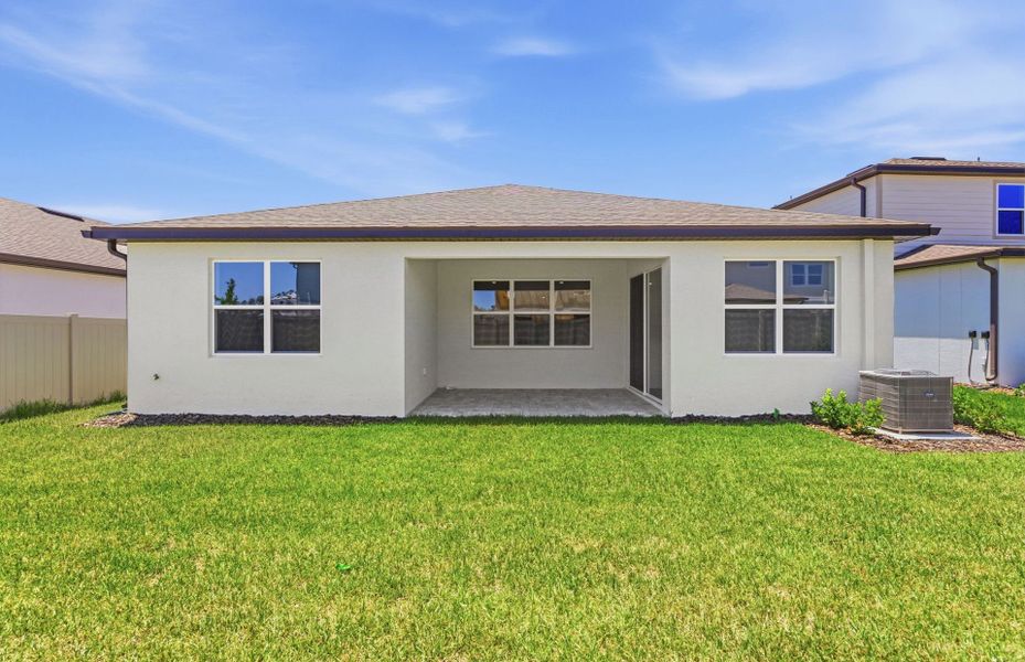 Exterior details and patio area of a home in Vida's Way, Wesley Chapel (Image 3).