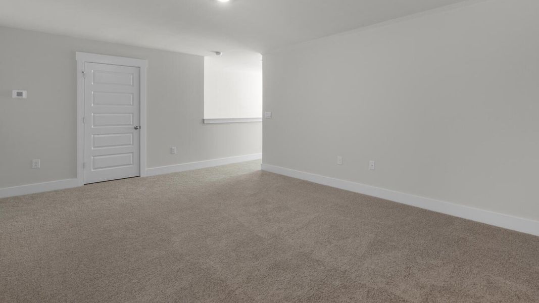 Spacious, unfurnished interior of a new home in Surfside Landing, Hubert (Image 24).