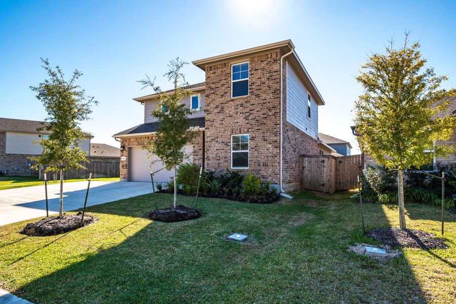 Front exterior of a new home in Heights of Barbers Hill, Baytown, TX, highlighting curb appeal (Image 25).