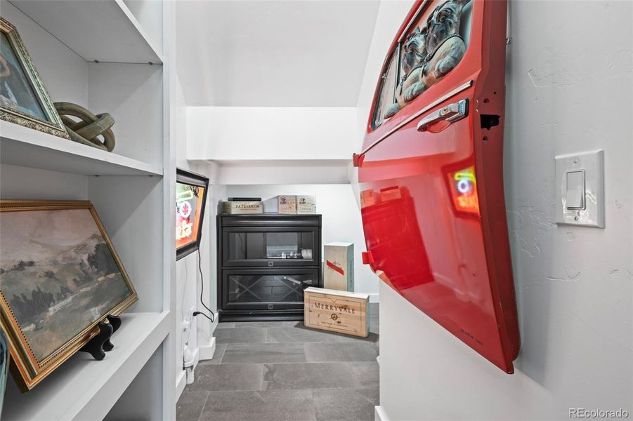 Hidden room with wine storage and fridge