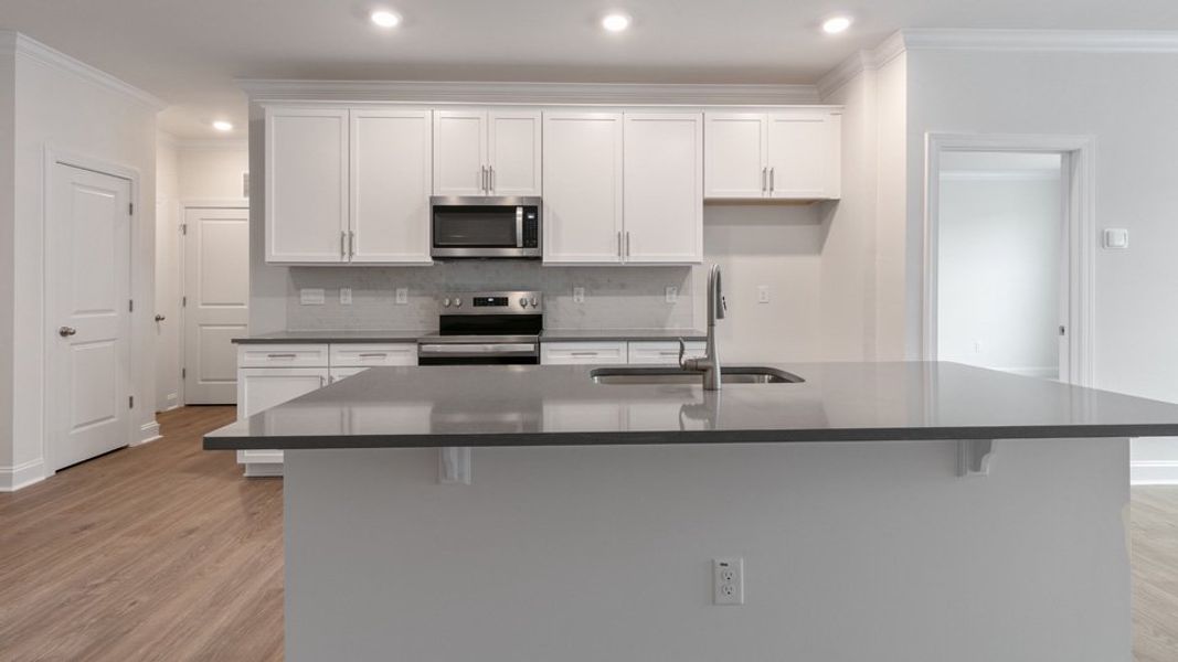 Representative furnished interior of a home built from the Savannah by D.R. Horton in The Meadows at Kinsley, Jamestown (Image 4).