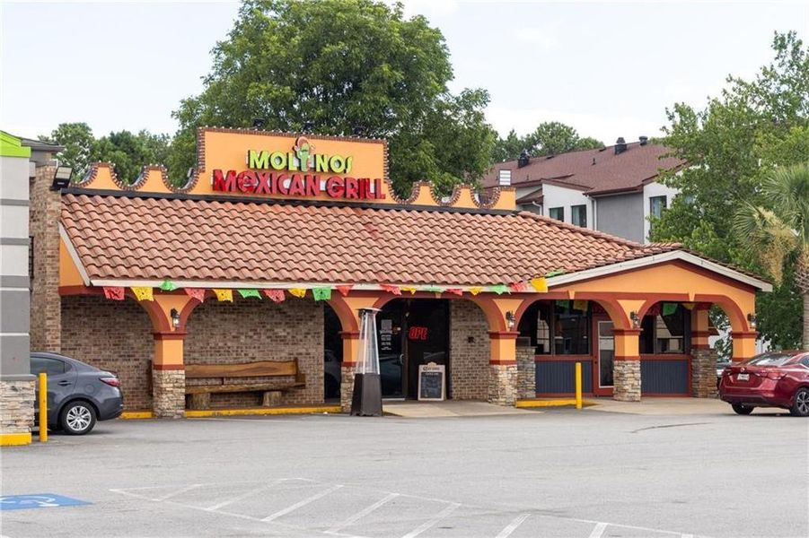 Front exterior of a new home in River Oaks, Locust Grove, GA, highlighting curb appeal (Image 3). Front exterior of a new home in River Oaks, Locust Grove, GA, highlighting curb appeal (Image 3).