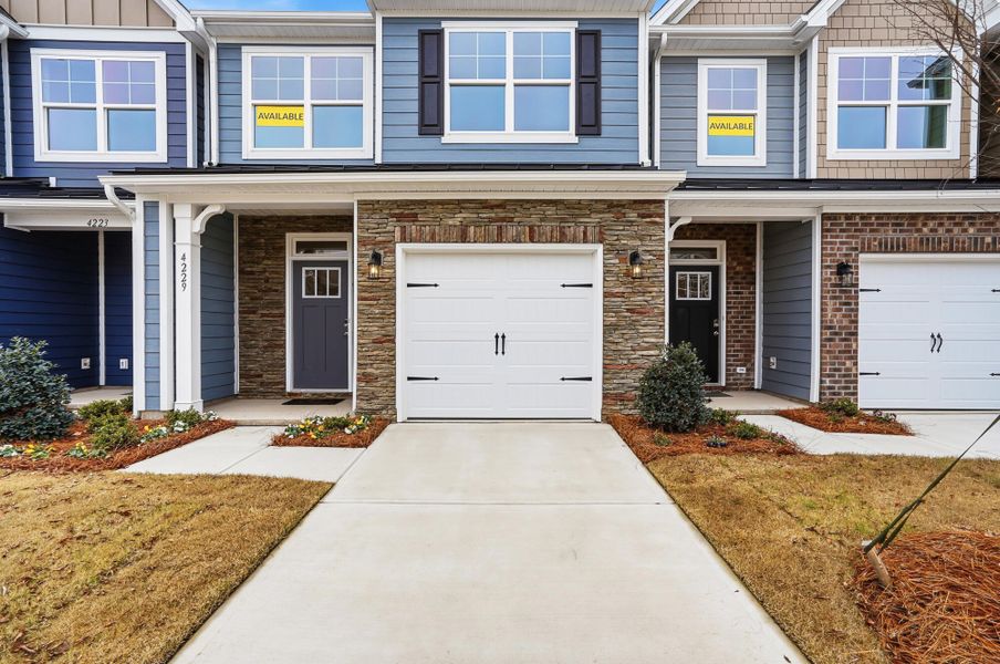 Front exterior of a new home in Harrisburg Village Townhomes, Harrisburg, NC, highlighting curb appeal (Image 23).