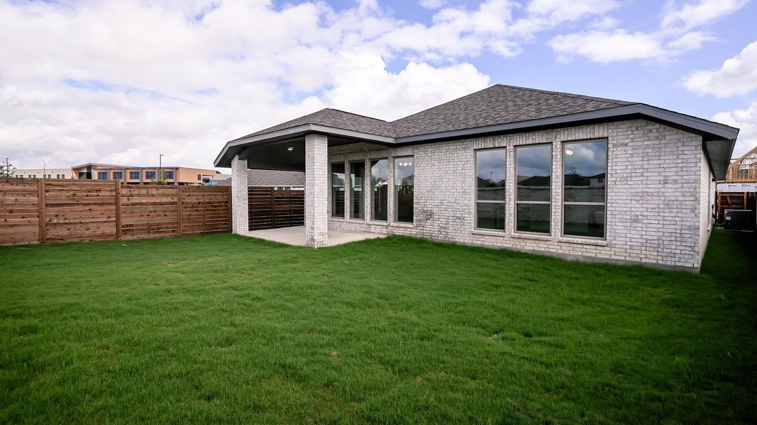 Exterior details and patio area of a home in Juniper Springs, Lockhart (Image 3).