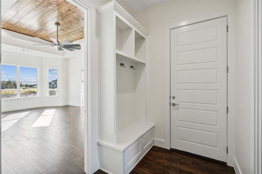 Mudroom with ceiling fan, dark hardwood / wood-style flooring, and wood ceiling