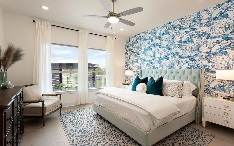 Generous windows illuminate this serene bedroom, offering views of the surrounding area. Generous windows illuminate this serene bedroom, offering views of the surrounding area.