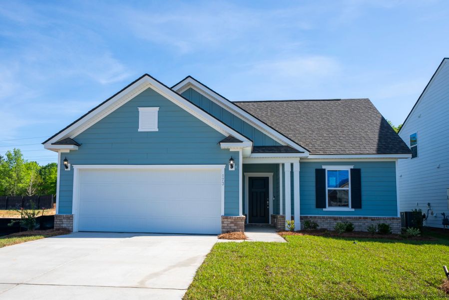 Front exterior of a new home in Monroe Preserve, Chapin, SC, highlighting curb appeal (Image 23). Front exterior of a new home in Monroe Preserve, Chapin, SC, highlighting curb appeal (Image 23).
