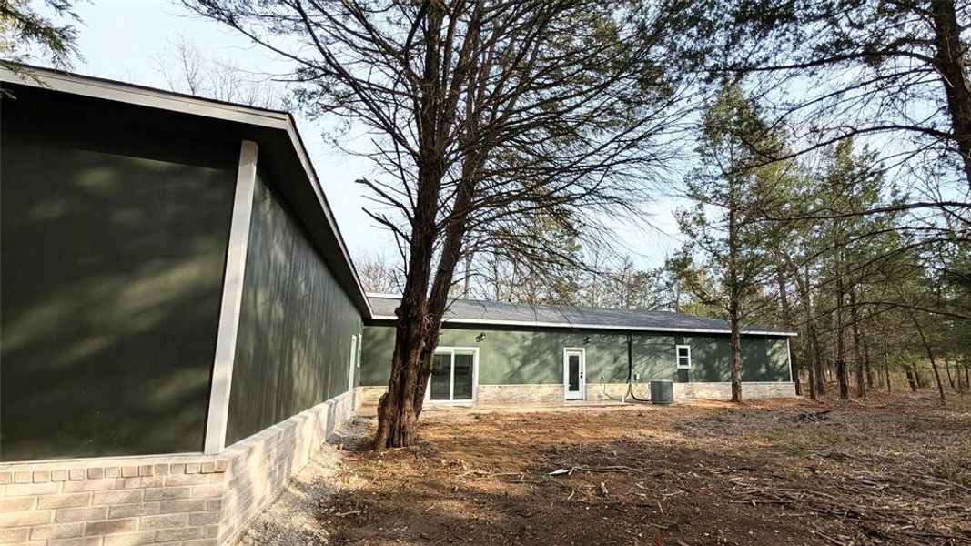 view of back of home with yard space view of back of home with yard space