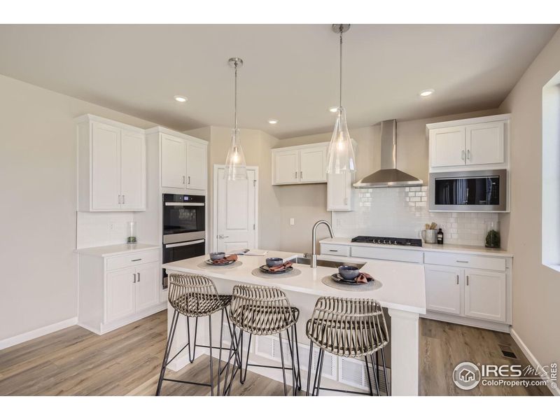 Kitchen *Photo not of actual home, but same floorplan and style*