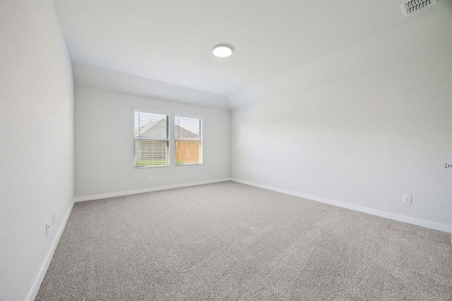 Primary Suite in the Heisman home plan by Trophy Signature Homes – REPRESENTATIVE PHOTO