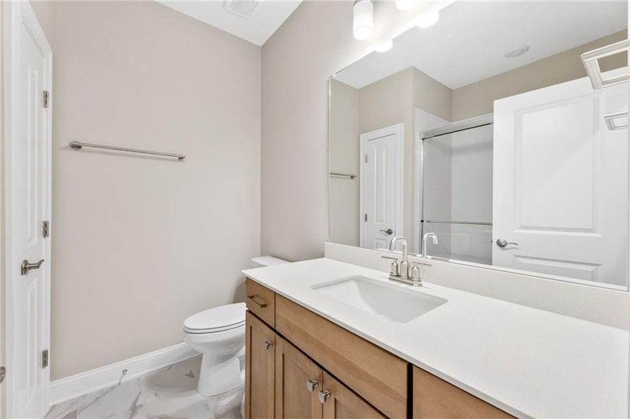 Furnished interior view inside a new home in The Courtyards at Bailey Farm, Dacula (Image 11).