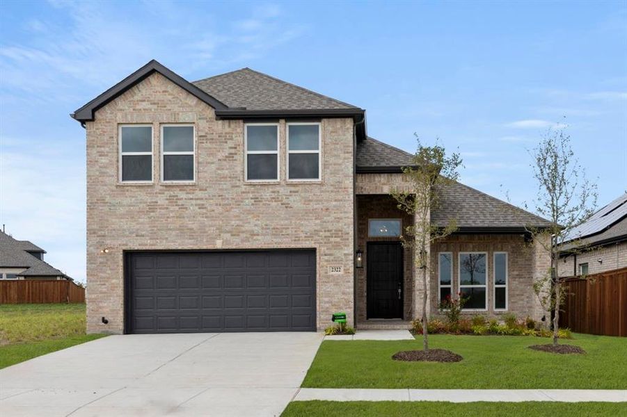 Front exterior of a new home in Las Lomas, Forney, TX, highlighting curb appeal (Image 21). Front exterior of a new home in Las Lomas, Forney, TX, highlighting curb appeal (Image 21).