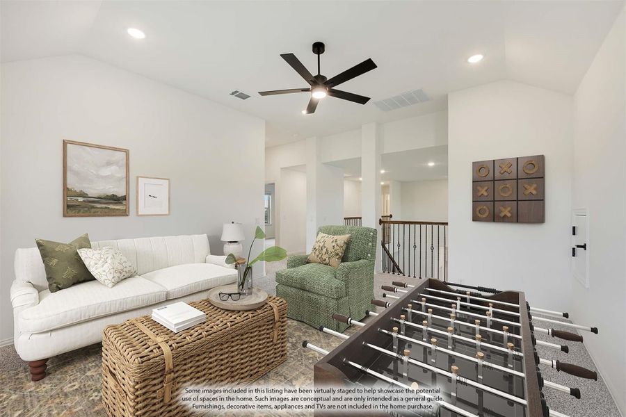 Upstairs bonus room with foosball table, white sofa, ceiling fan, and staircase railing visible in background.