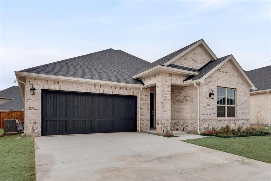 Front exterior of a new home in Sutton Fields, Celina, TX, highlighting curb appeal (Image 24).