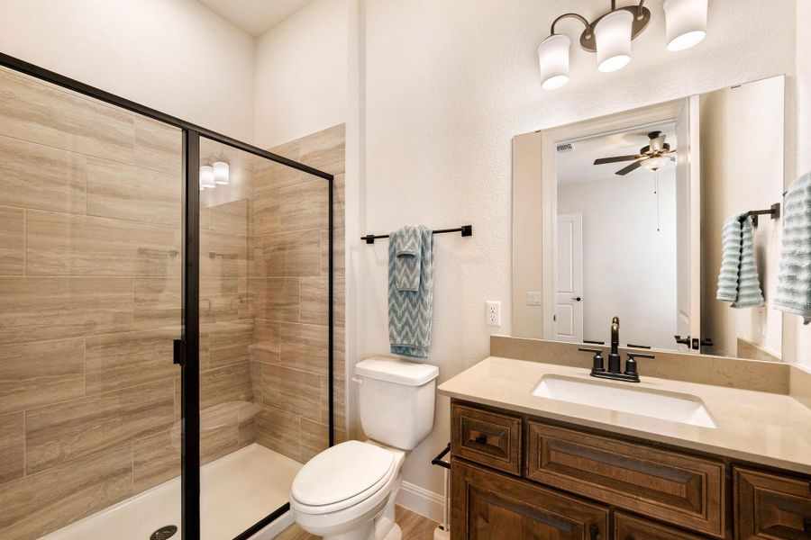 A well-appointed bathroom features a glass-enclosed shower and a vanity with ample counter space. A well-appointed bathroom features a glass-enclosed shower and a vanity with ample counter space.