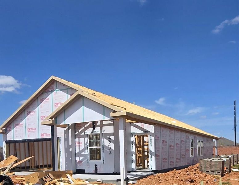 Front exterior of a new home in Sunterra, Katy, TX, highlighting curb appeal (Image 13). Front exterior of a new home in Sunterra, Katy, TX, highlighting curb appeal (Image 13).