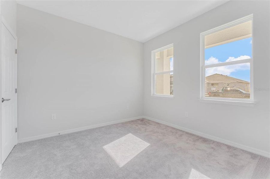Spacious, unfurnished interior of a new home in Covered Bridge at Liberty Bluff, Haines City (Image 29).
