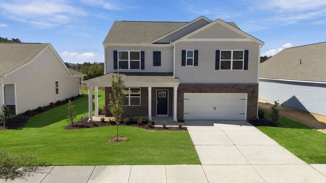Front exterior of a new home in West New Bern, New Bern, NC, highlighting curb appeal (Image 1). Front exterior of a new home in West New Bern, New Bern, NC, highlighting curb appeal (Image 1).