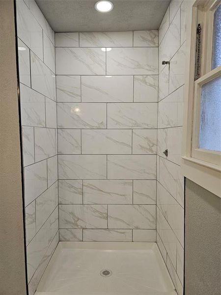 Bathroom with tiled shower Bathroom with tiled shower