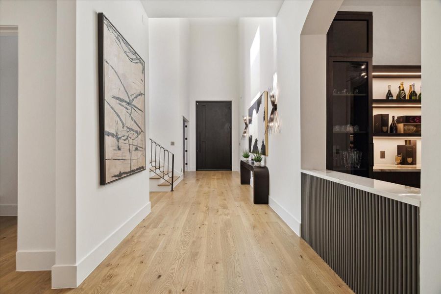 Upon entering, one's attention is immediately drawn to the custom-built bar area