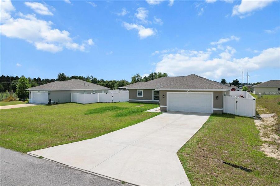 Front exterior of a new home in , Ocala, FL, highlighting curb appeal (Image 20).