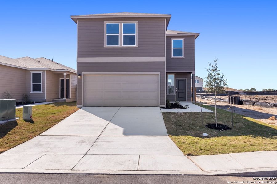 Front exterior of a new home in Punta Verde, Converse, TX, highlighting curb appeal (Image 1).