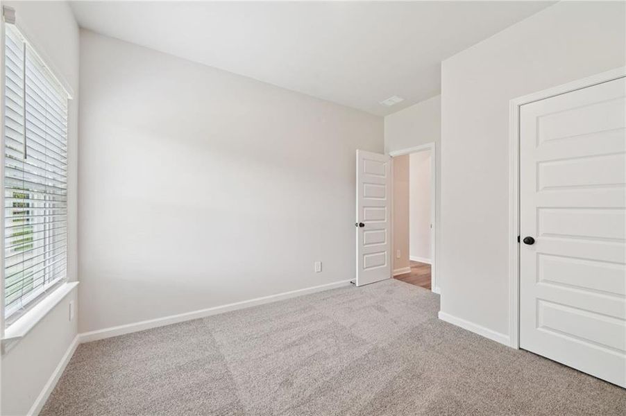 Spacious, unfurnished interior of a new home in Vines at Mill Creek - Estate Series, Braselton (Image 25).