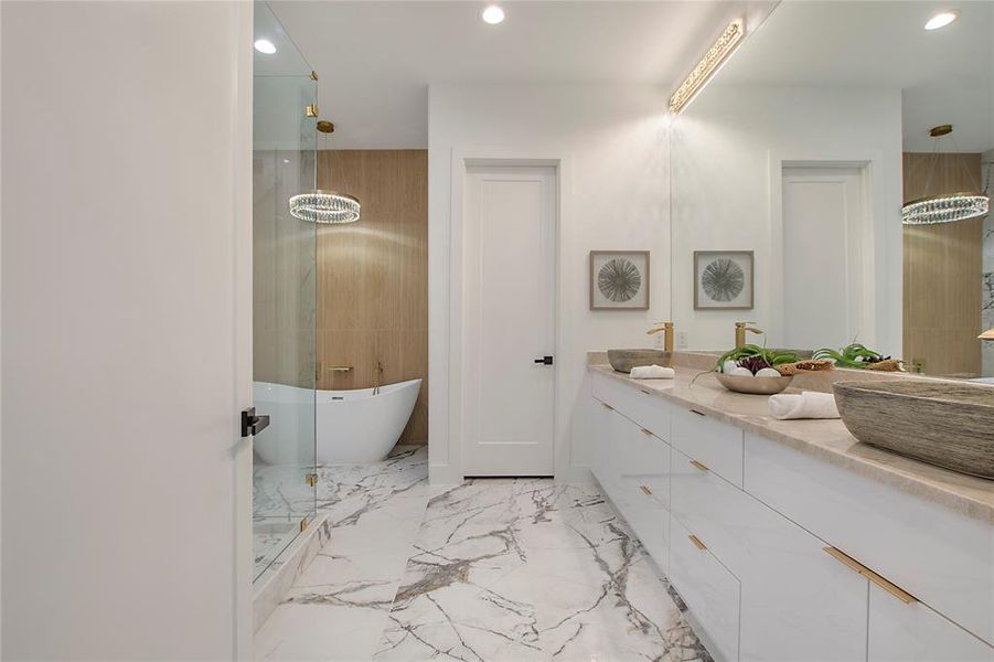 Bathroom featuring shower with separate bathtub and vanity