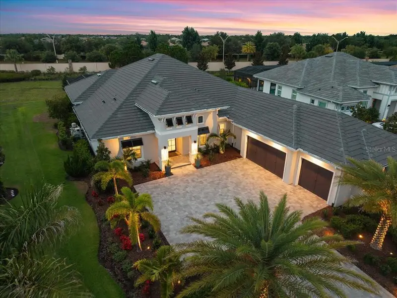 Front exterior of a new home in , Lakewood Ranch, FL, highlighting curb appeal (Image 24). Front exterior of a new home in , Lakewood Ranch, FL, highlighting curb appeal (Image 24).