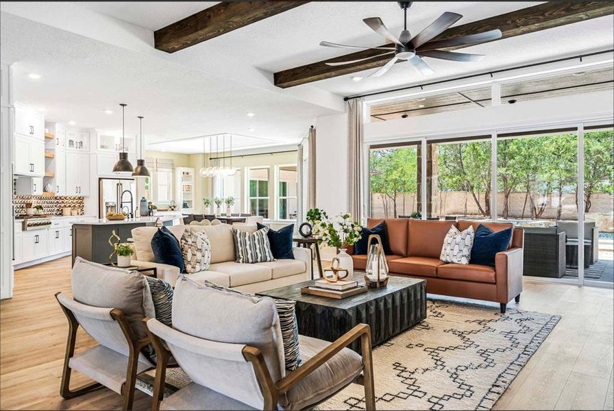 Large open living/kitchen family room. Photo courtesy of David Weekley Homes