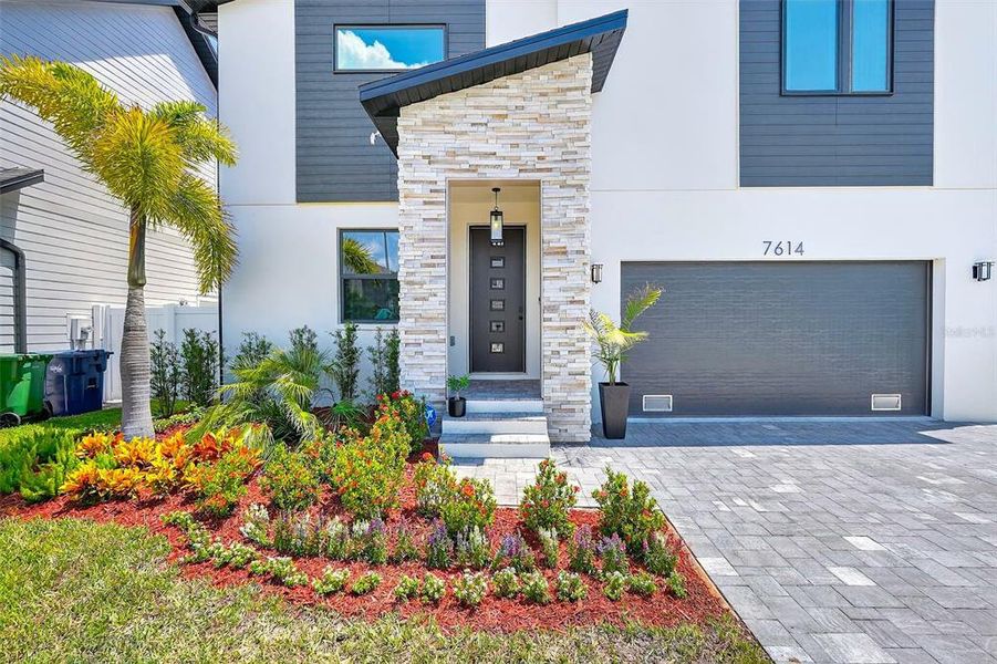 Front exterior of a new home in , Tampa, FL, highlighting curb appeal (Image 23).