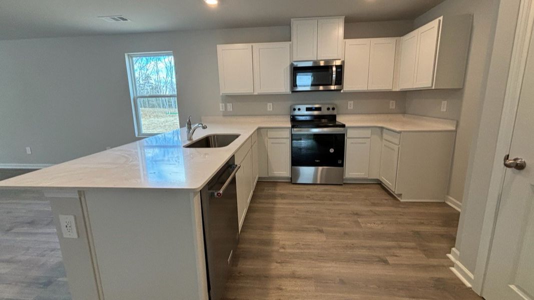 Furnished interior view inside a new home in Saddle Trace, Lewisburg (Image 4).