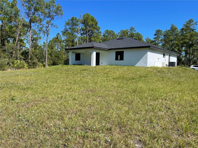 Exterior details and patio area of a home in , Lehigh Acres (Image 25). Exterior details and patio area of a home in , Lehigh Acres (Image 25).