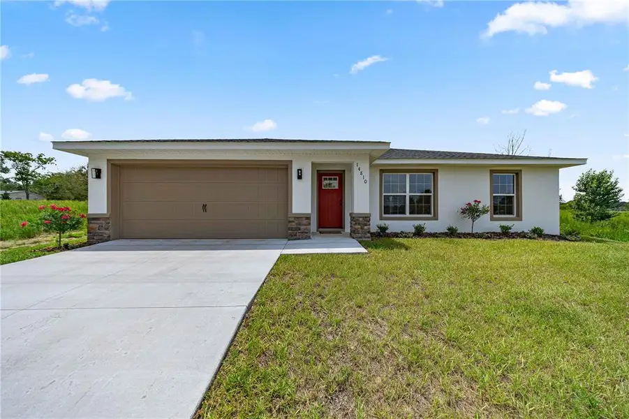 Front exterior of a new home in , Ocala, FL, highlighting curb appeal (Image 1). Front exterior of a new home in , Ocala, FL, highlighting curb appeal (Image 1).