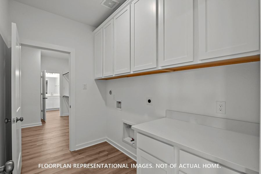 Furnished interior view inside a new home in The Oaks on 6th Street, Magnolia (Image 8).