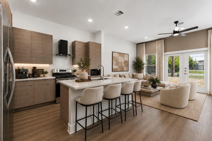 Open-concept living designed for connection, featuring elevated ceilings, abundant natural light, and seamless flow into the kitchen and dining spaces.
